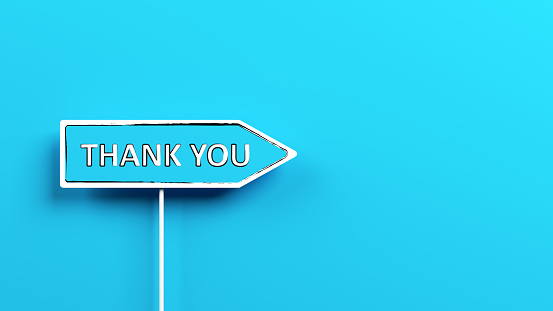 Blue arrow sign with thank you text on it. On blue-colored background.Horizontal composition with copy space