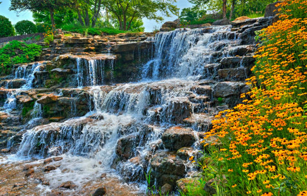 istock Waterfall with spring flowers-Hamilton County, Indiana 1322894931