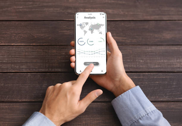 istock Black businessman using financial app on mobile phone 1322895103