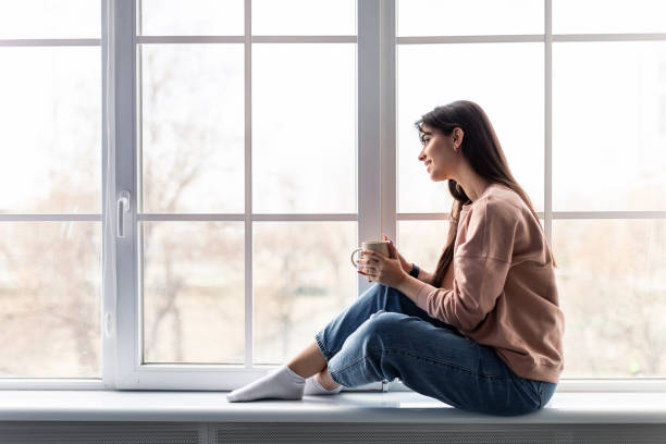 istock Woman having rest at home on the weekend drinking coffee 1322895650