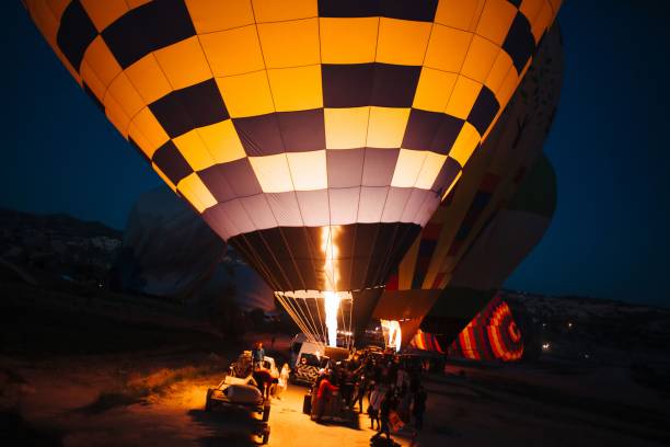 istock inflating hot air balloons at night 1322895848