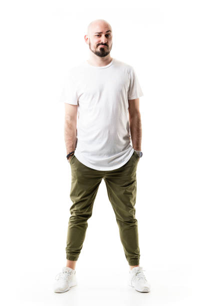 istock Distrustful expression of young bald man looking at camera with raised eyebrow 1322896987