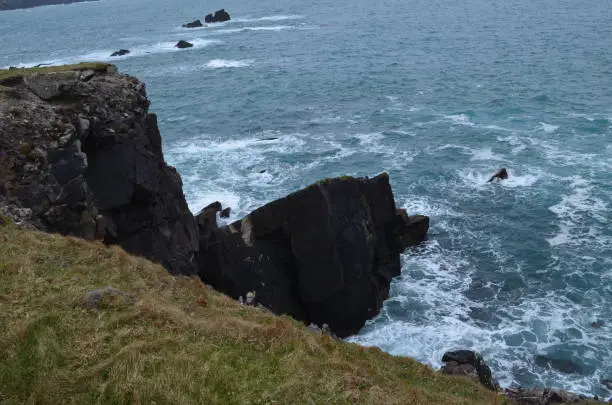Steep drop into the waters from the slea head pennisula in Ireland