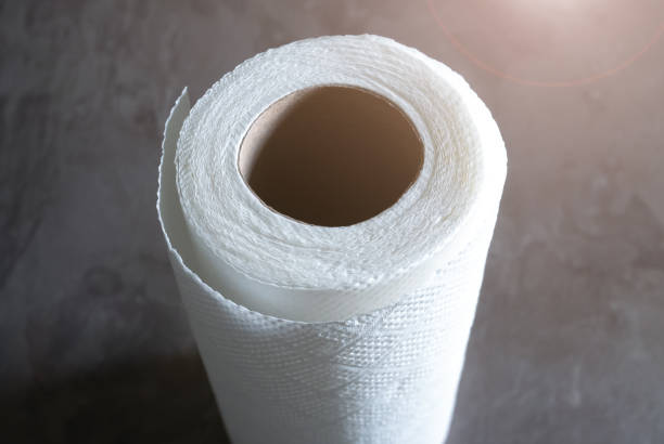 istock White kitchen paper towel rolls. Napkins on the table. 1322899752