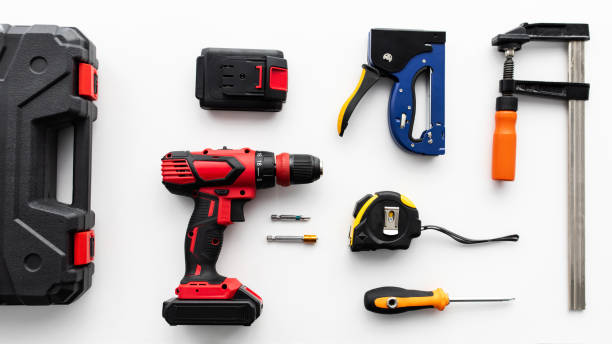 istock Set of various instruments on white background, top view. Tool case, electric drill, ruler and clamp tools, flat lay 1322900083