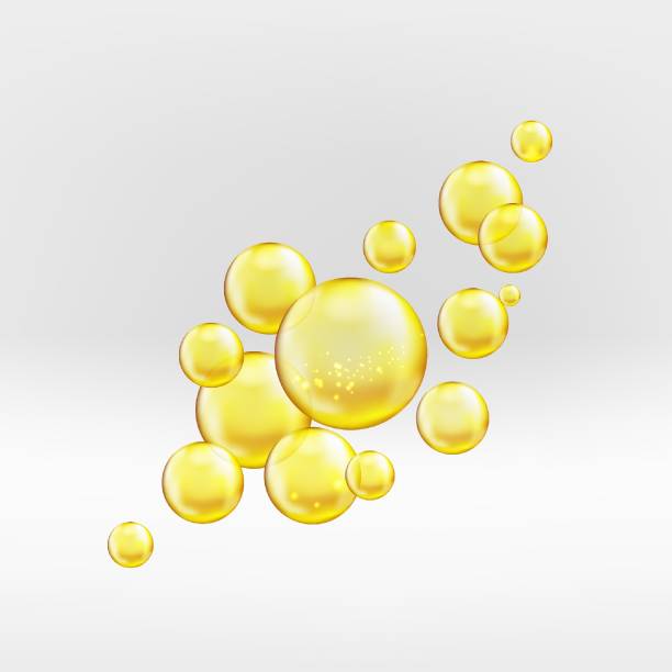 istock Gold serum oil droplets isolated on greyish background. Yellow collagen bubbles with sparkles and lights composition. Golden emulsion with reflection. 1322901020