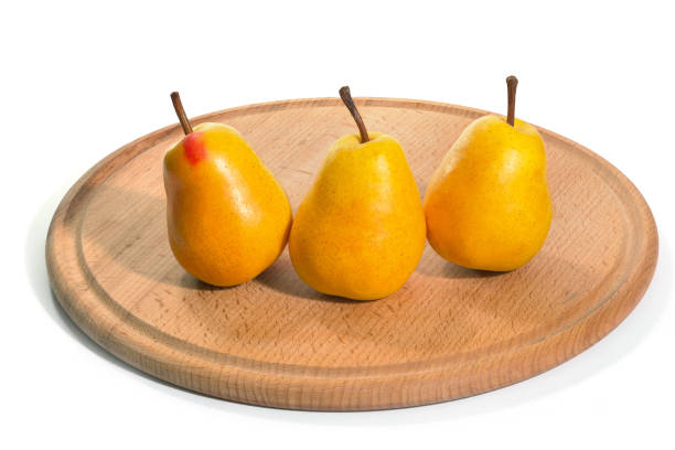 istock Ripe pears on a tray. On the isolated white background 1322906081