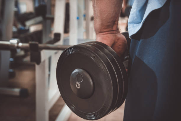 istock Muscular man during workout in the gym 1322906102