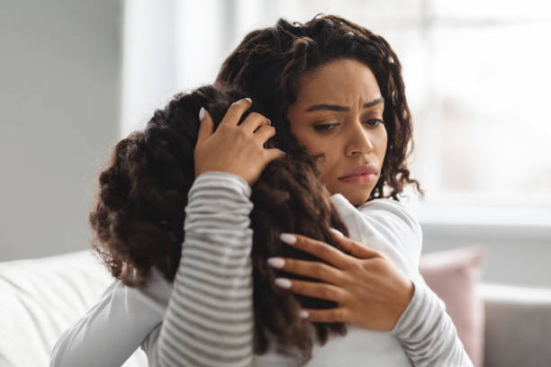 istock Young black mother comforting her crying daughter 1322906189