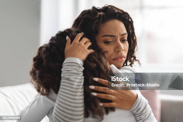 Young Black Mother Comforting Her Crying Daughter Stock Photo - Download Image Now - Crying, Mother, Child