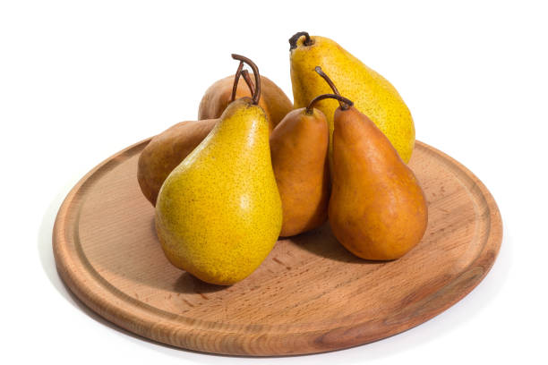 istock The ripe yellow pears on a tray isolated a white background 1322906364