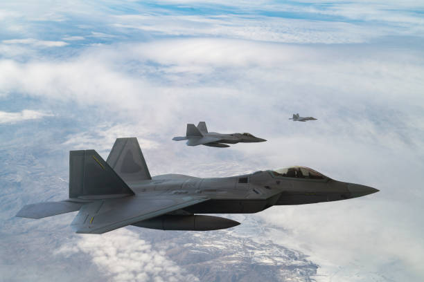 istock Jet fighters flying over the clouds. 1322906425