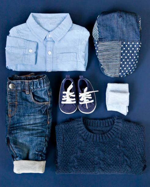 istock Denim outfit for little boy on classic blue background. 1322911701