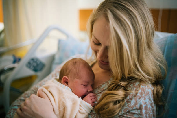 istock View of newborn sleeping on mother's chest 1322913695