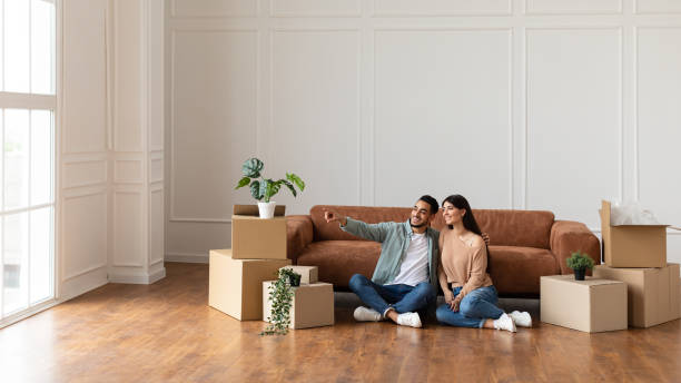 istock Happy man and sitting on floor choosing interior design 1322915700