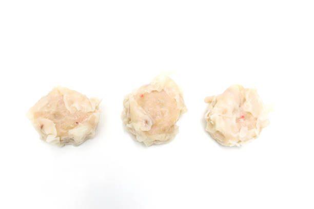 Steamed chinese shrimp dumpling wrapped in a thin flour‐and‐water pancake called shaomai.