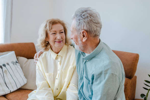 istock Senior couple is embracing at home 1322918139