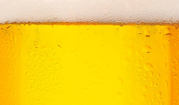 istock Beer bubbles close up, beverage and clients order in pub. Drink texture, business and ad 1322920020