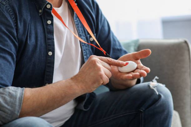 istock Hand pushing panic button on emergency equipment for old people 1322920950