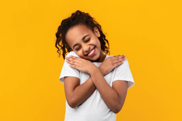istock Black girl keeping hands on chest at studio 1322921258