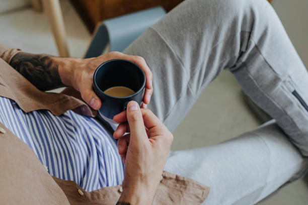 istock Anonymous Man Sitting and Enjoying a Cup of Coffee 1322923383