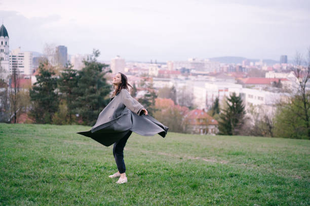 Young runs and dances through city park