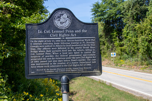 Comer, Georgia - May 21, 2021: Close-up of a historical marker overlooking the Broad River Bridge where Lt. Col. Lemuel Penn, an African American WWI veteran, was murdered by members of the Ku Klux Klan