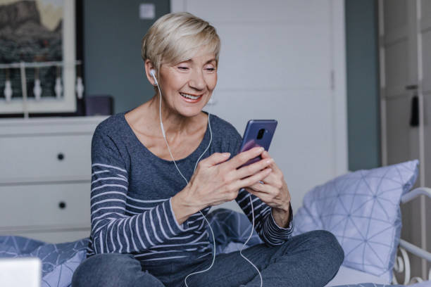 istock Senior woman is having a headache at home 1322924701