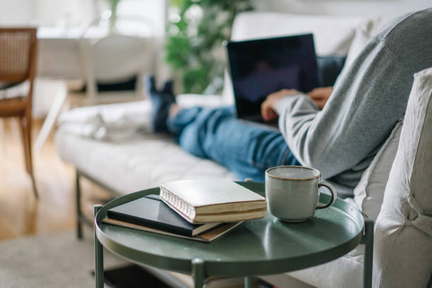Young man works online from living room
