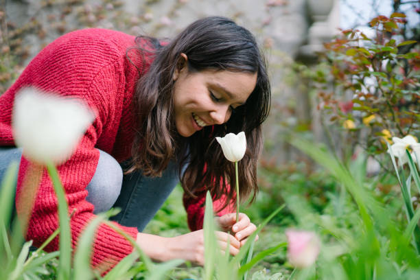 istock Young woman gardens in her back yard 1322927441