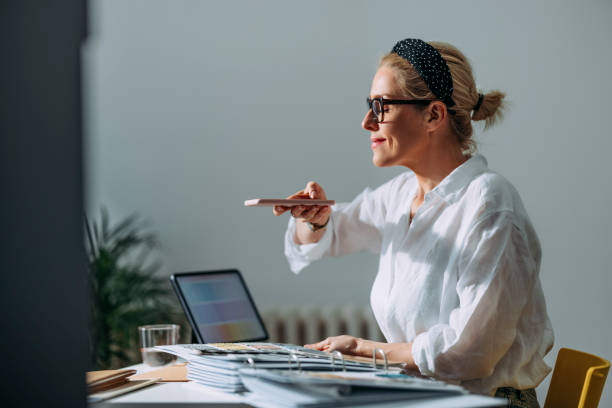 istock Young Woman Choosing Colour Palette For New Flat Using Mobile 1322927650