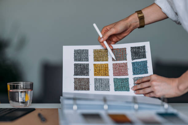 istock Young Woman At The Table Choosing Colour Palette For New Flat 1322927682
