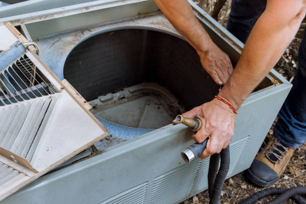istock Professional man is fixing the air conditioner 1322928505