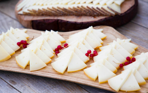istock Pieces of cheese with red figs 1322931770