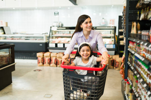 istock Fun young woman shopping with her kid 1322935540