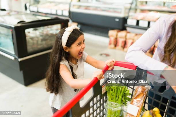 Annoyed Young Daughter Shouting In The Store Stock Photo - Download Image Now - Child, Tantrum, Shouting