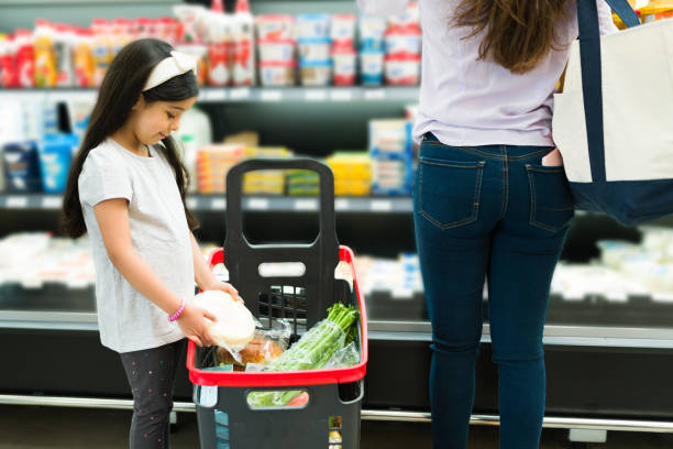Rear view of a cute kid choosing groceries