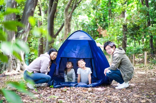 istock Family camping in the forest 1322936411