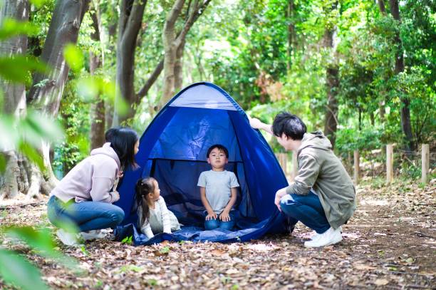 istock Family camping in the forest 1322936420