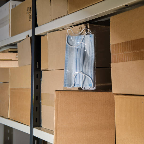 istock Storage of protective face masks in a warehouse among cardboard boxes 1322942151