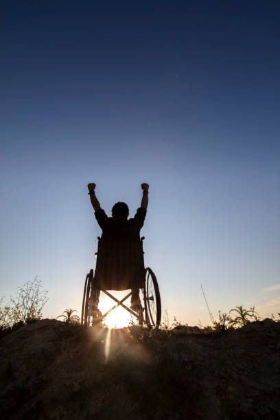 istock Disability man success on wheelchair 1322943757