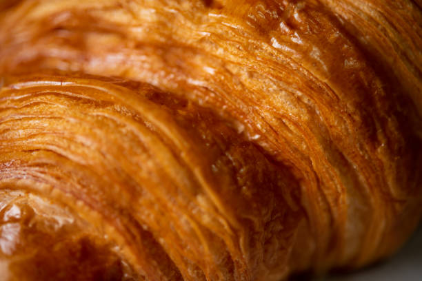 istock Croissant bakery on white wooden table 1322945059