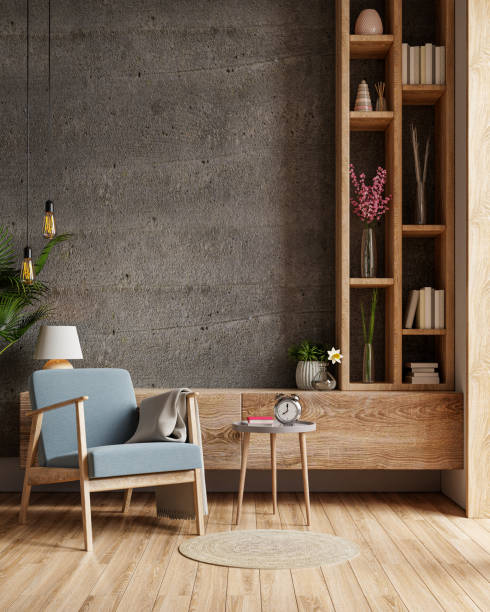 istock Concrete Interior room with blue armchair on empty dark wall background. 1322945089