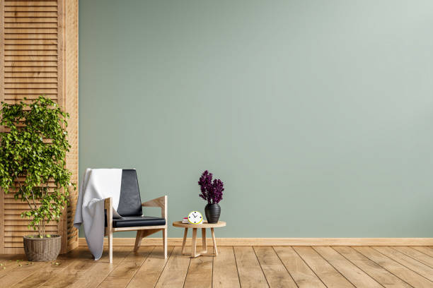 istock Modern minimalist interior with an armchair on empty green wall background. 1322945273