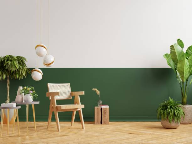 istock Modern minimalist interior with an armchair on empty green and white wall background. 1322945282