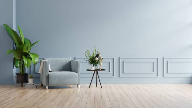 istock Modern minimalist interior with an armchair on empty blue wall background. 1322945285