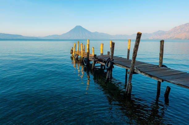 Atitlan Lake with pier at sunrise, Panajachel, Guatemala.