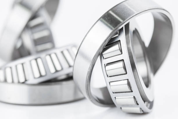 Close-up of Tapered roller bearings spare part of mechanical on the white background. stock photo