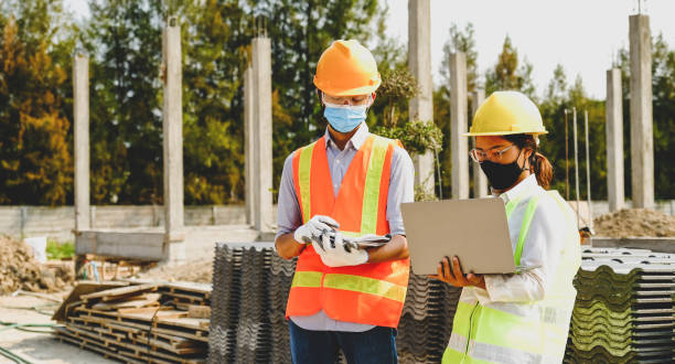 istock Engineer contractor team meeting work safety plan industry project and check design at the construction building site 1322956175