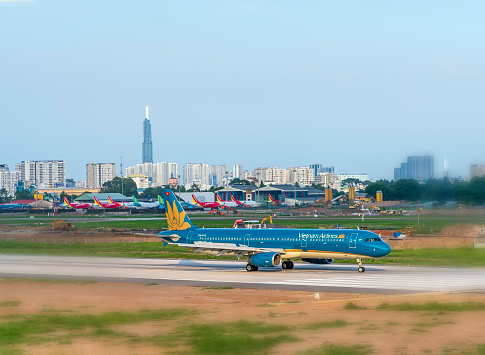 Ho Chi Minh City, Vietnam - May 20th, 2021: Cargo plane Airbus A321 of Vietnam Airlines landing at Tan Son Nhat International Airport, Ho Chi Minh City, Vietnam